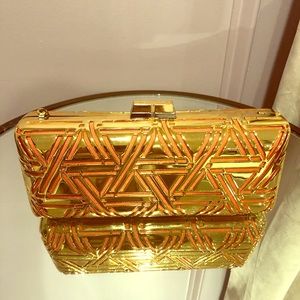 Gold and Orange BCBGMAXAZRIA clutch on chain